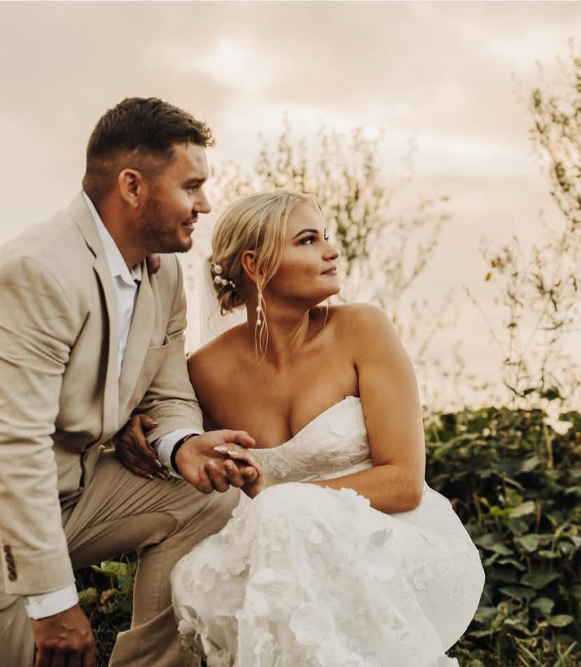 Maria Morrison bridal makeup on a bride seated with her groom